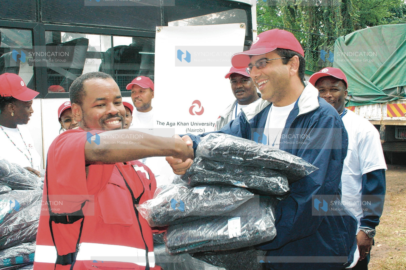 Chief Operating manager The Aga Khan University hospital Moyez Jadavji presents blankets to Red Cross official