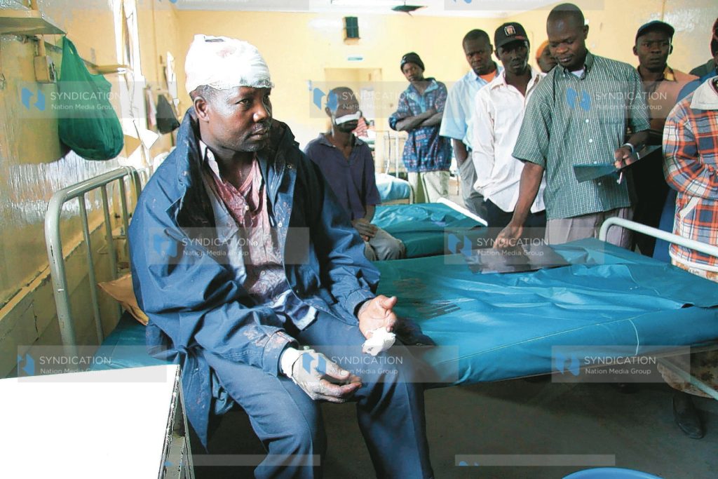 Samson Odhiambo nurses his wounds afflicted on him in the on-going post-election violence