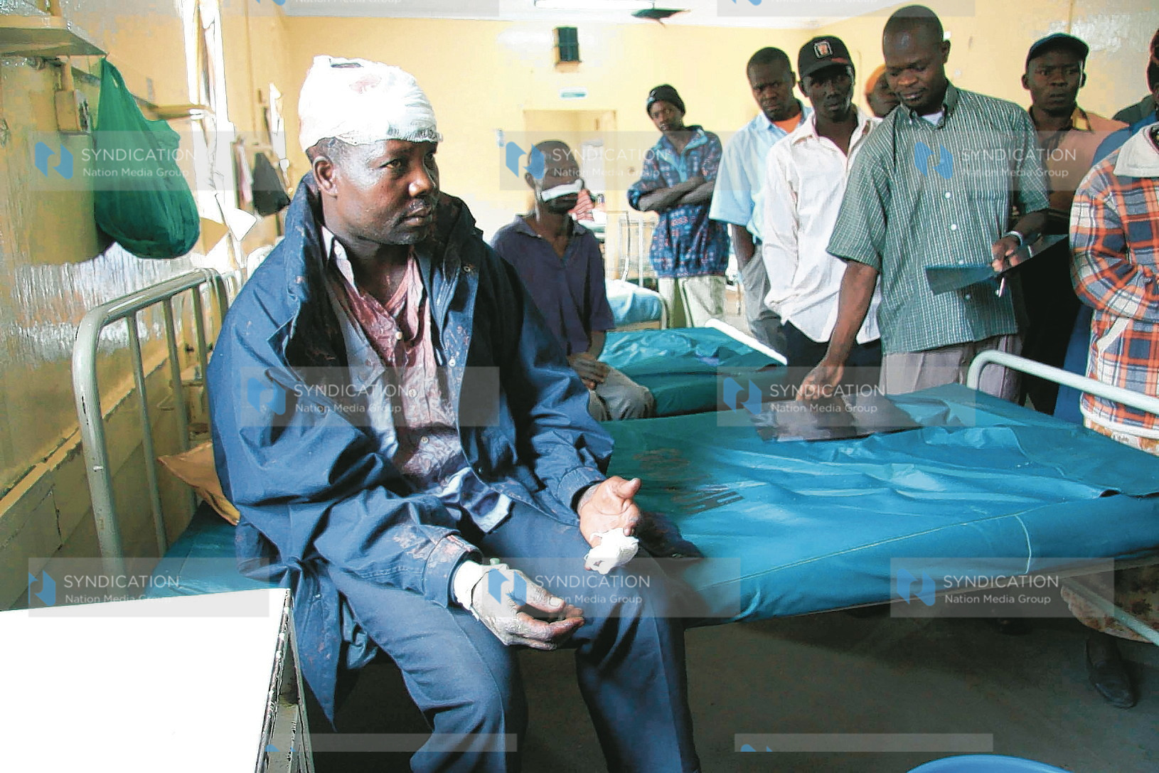 Samson Odhiambo nurses his wounds afflicted on him in the on-going post-election violence