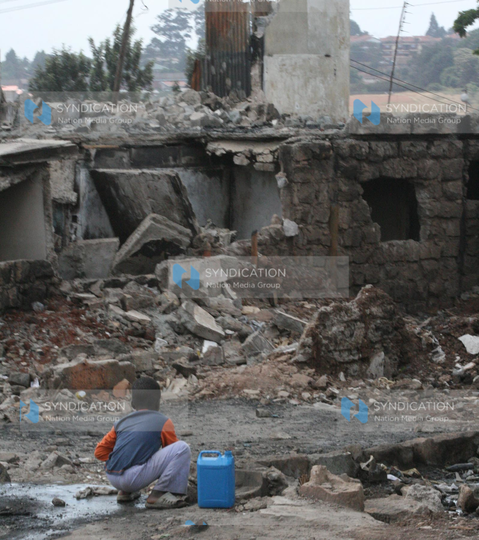 child play near a destroyed building rubble in Kibera slum, after the post-election violence