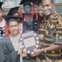 Nancy Njeri with Deputy Vice -Chancellor Academic affairs Prof Jacob Kaimenyi of Nairobi University
