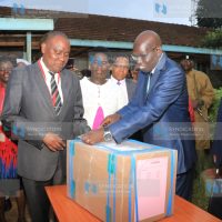 Education PS Belio Kipsang, supervises the distribution of KCPE examination