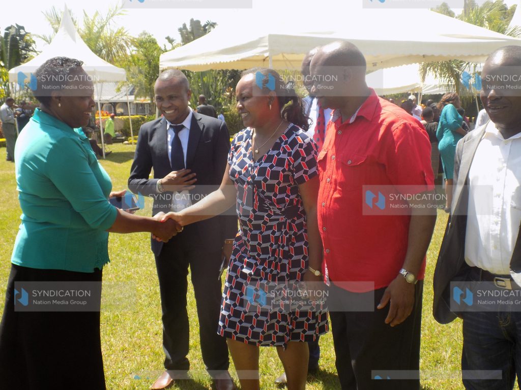 Anne Waiguru, Kirinyaga County Governor, greets a Jubilee supporter
