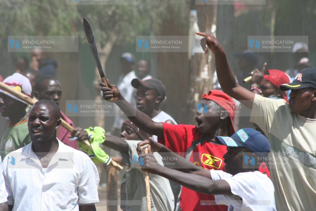 Youths brandish weapons during post-election violence