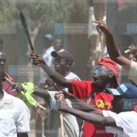 Youths brandish weapons during post-election violence