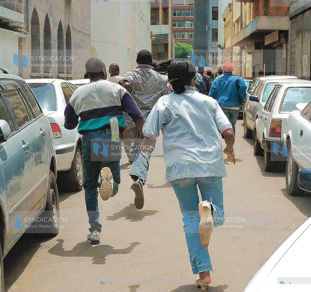 ODM supporters run away from the police