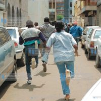 ODM supporters run away from the police
