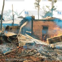 A burning house torched by youths at Ilula in Eldoret go up in flames