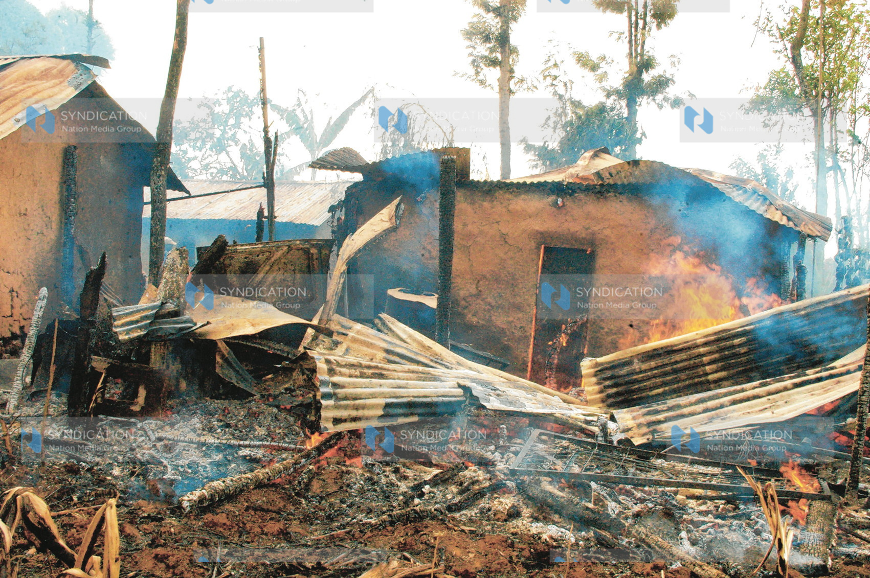 A burning house torched by youths at Ilula in Eldoret go up in flames