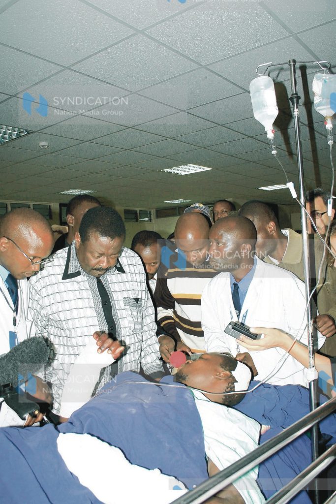 Sabatia MP who is also a member of ODM leadership Mr. Musalia Mudavadi consoling a victim of post-election violence