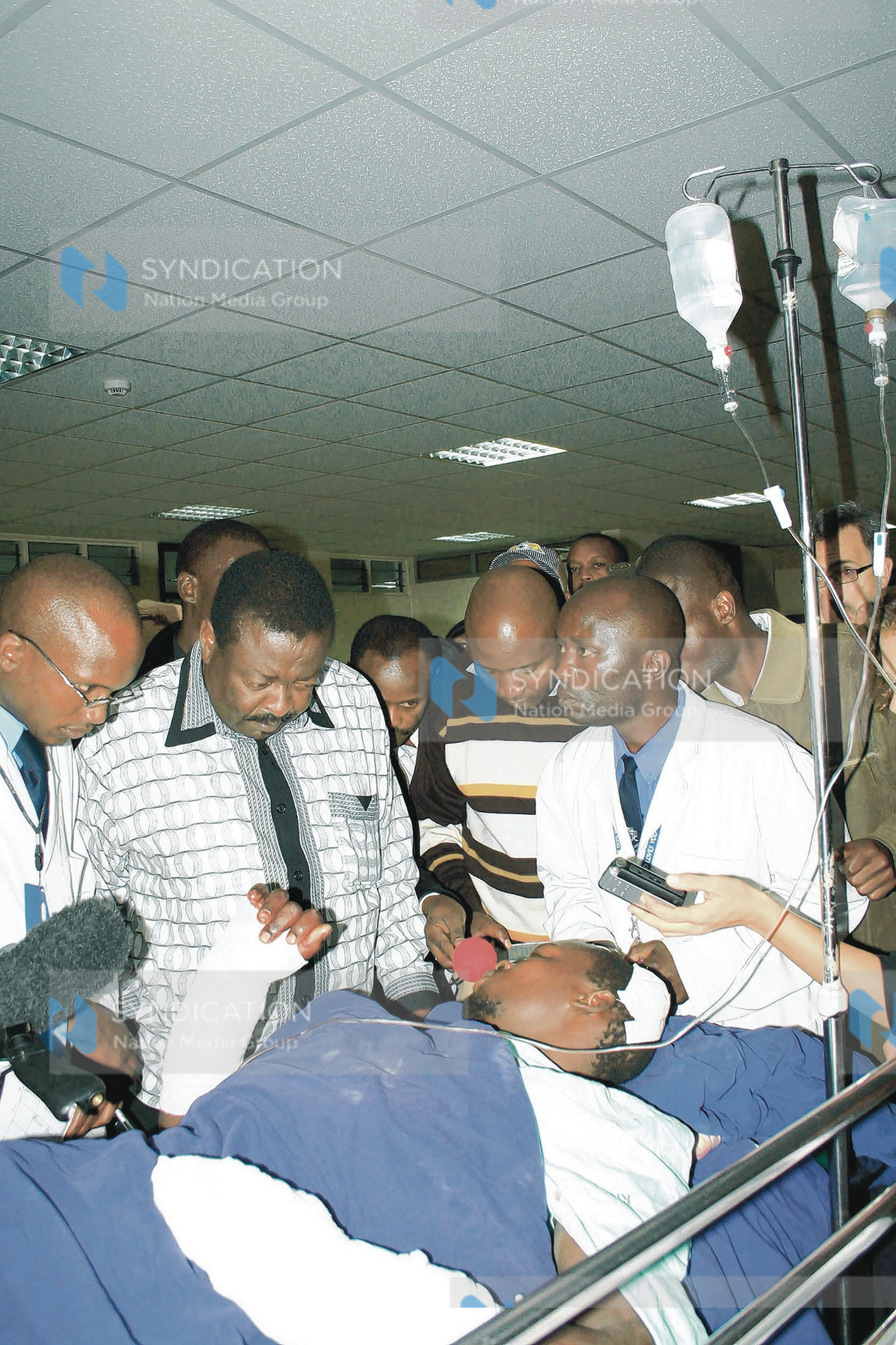 Sabatia MP who is also a member of ODM leadership Mr. Musalia Mudavadi consoling a victim of post-election violence
