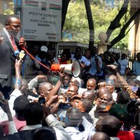 Paul Otuoma addresses City Council of Nairobi workers outside Jogoo house