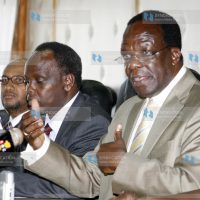 Wycliffe Oparanya, flanked by his Permanent Secretary Edward Sambili (centre)