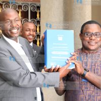 Speaker of the Senate Kenneth Lusaka (right) receives BBI report