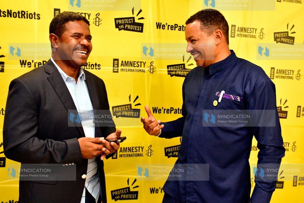 Director Irungu Houghton (right) confers with HAKI Africa Executive Director Hussein Khalid