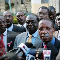 Minister for Justice and Constitutional Affairs Mutula Kilonzo (right) addresses journalists