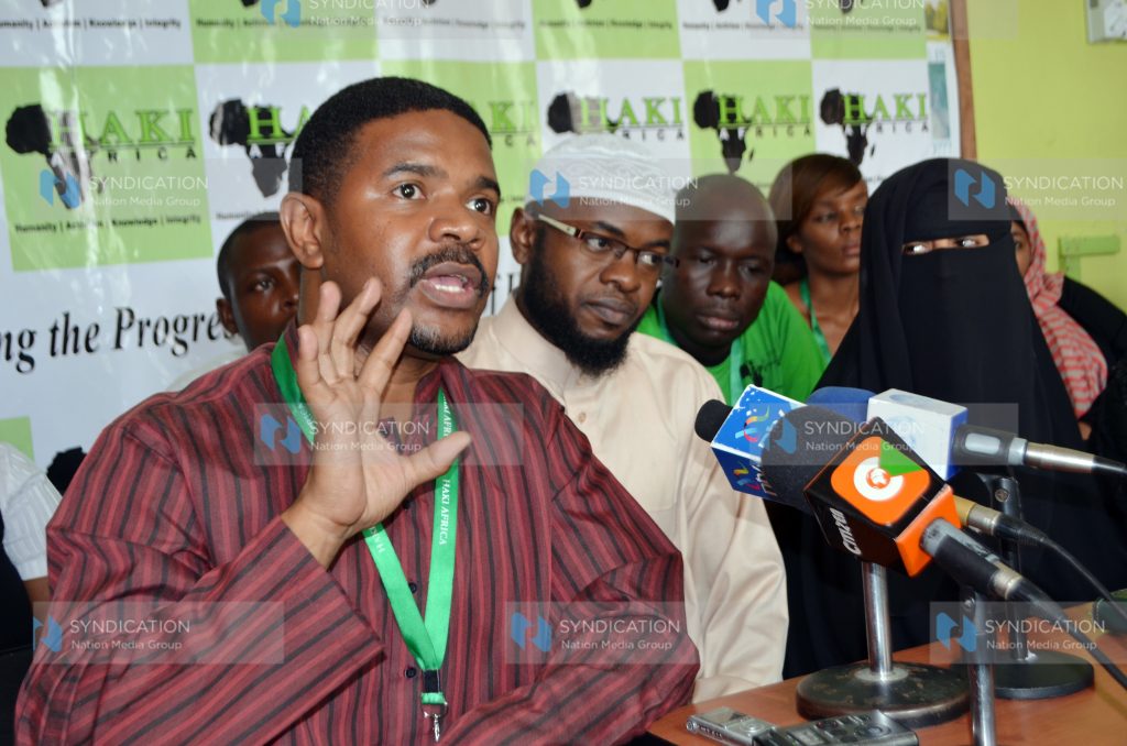 Haki Africa Executive Director Hussein Khalid (left) with other Human Rights officers addresses the press