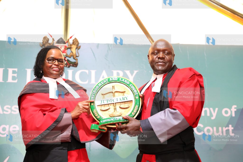 Chief Justice Martha Koome presents instruments of power to Justice Oscar Angote
