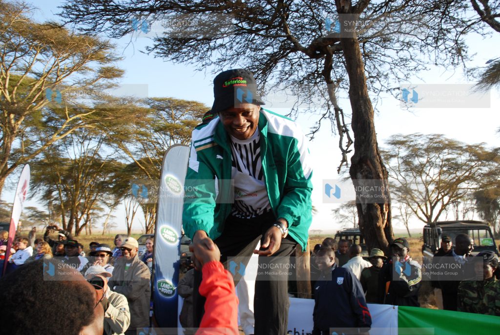 Speaker of Parliament Justin Muturi greets marathoners