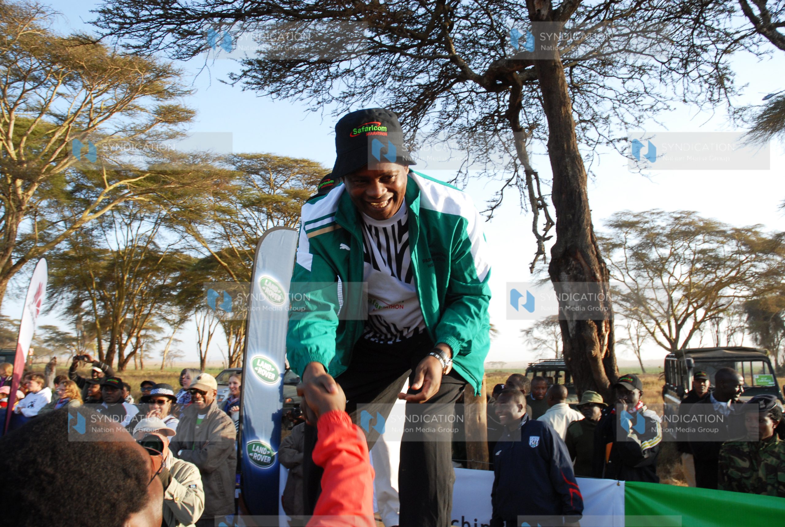Speaker of Parliament Justin Muturi greets marathoners