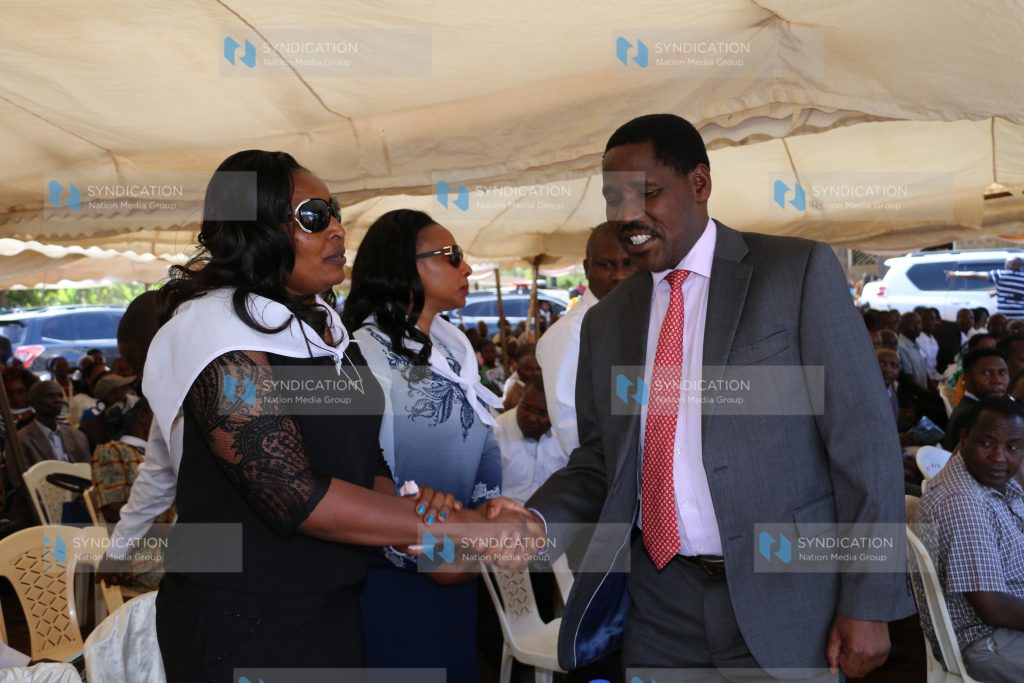 Meru Governor Peter Munya (right) consoles Kate Maore