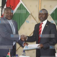 The outgoing Rift Valley Regional Coordinator Chimwanga Mongo welcomes the former Narok County Commissioner George Natembeya