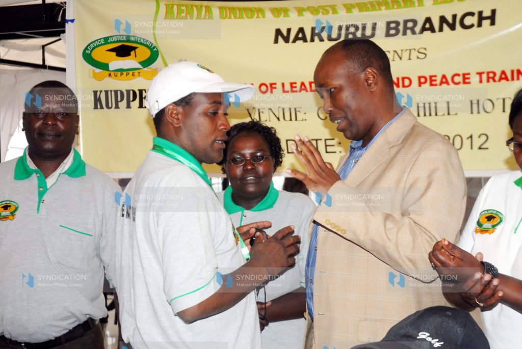 Nakuru Town MP Lee Kinyanjui chats with the Kenya Union of Post Primary Education Teachers