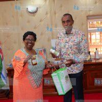 JKUAT Vice Chancellor Victoria Wambui Ngumi presents JKUAT value-added products to Kiambu County Governor Kimani Wamatangi