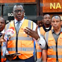 Davis Chirchir (centre) briefs the media