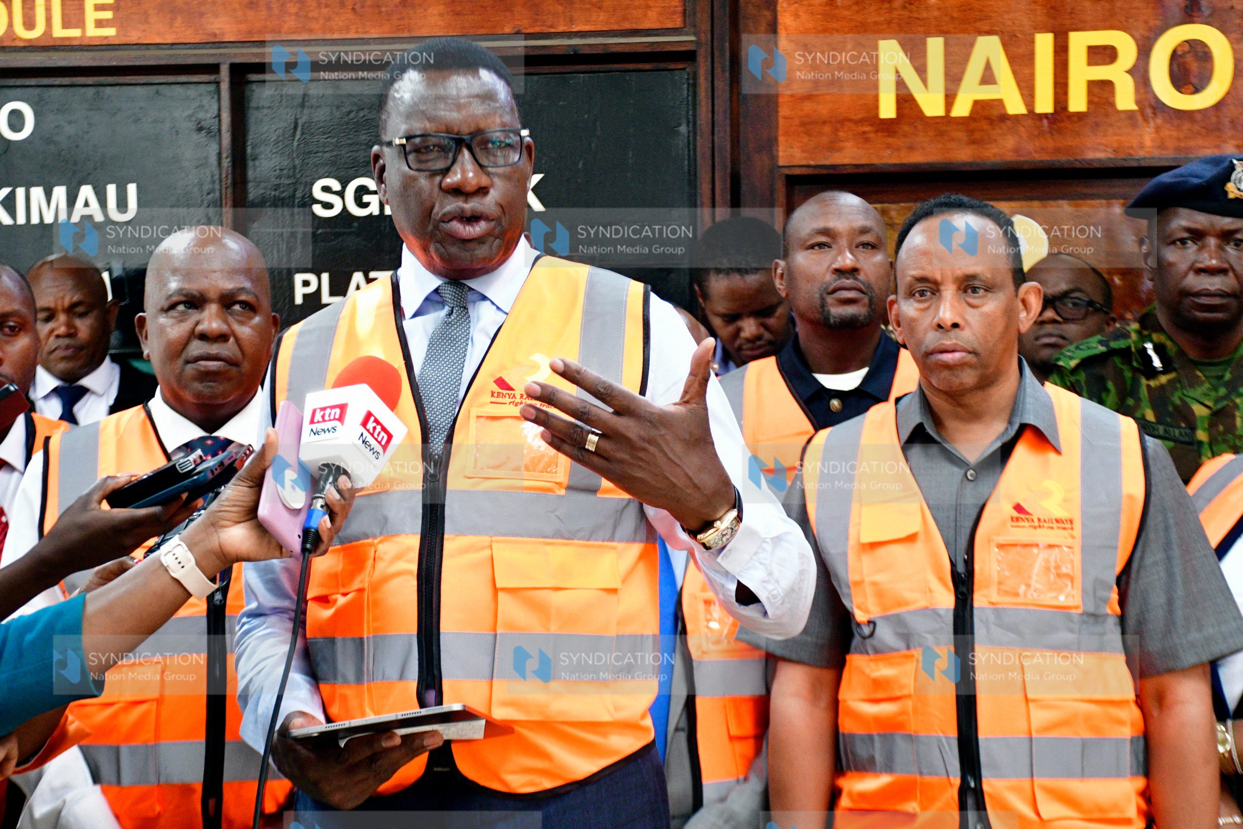 Davis Chirchir (centre) briefs the media