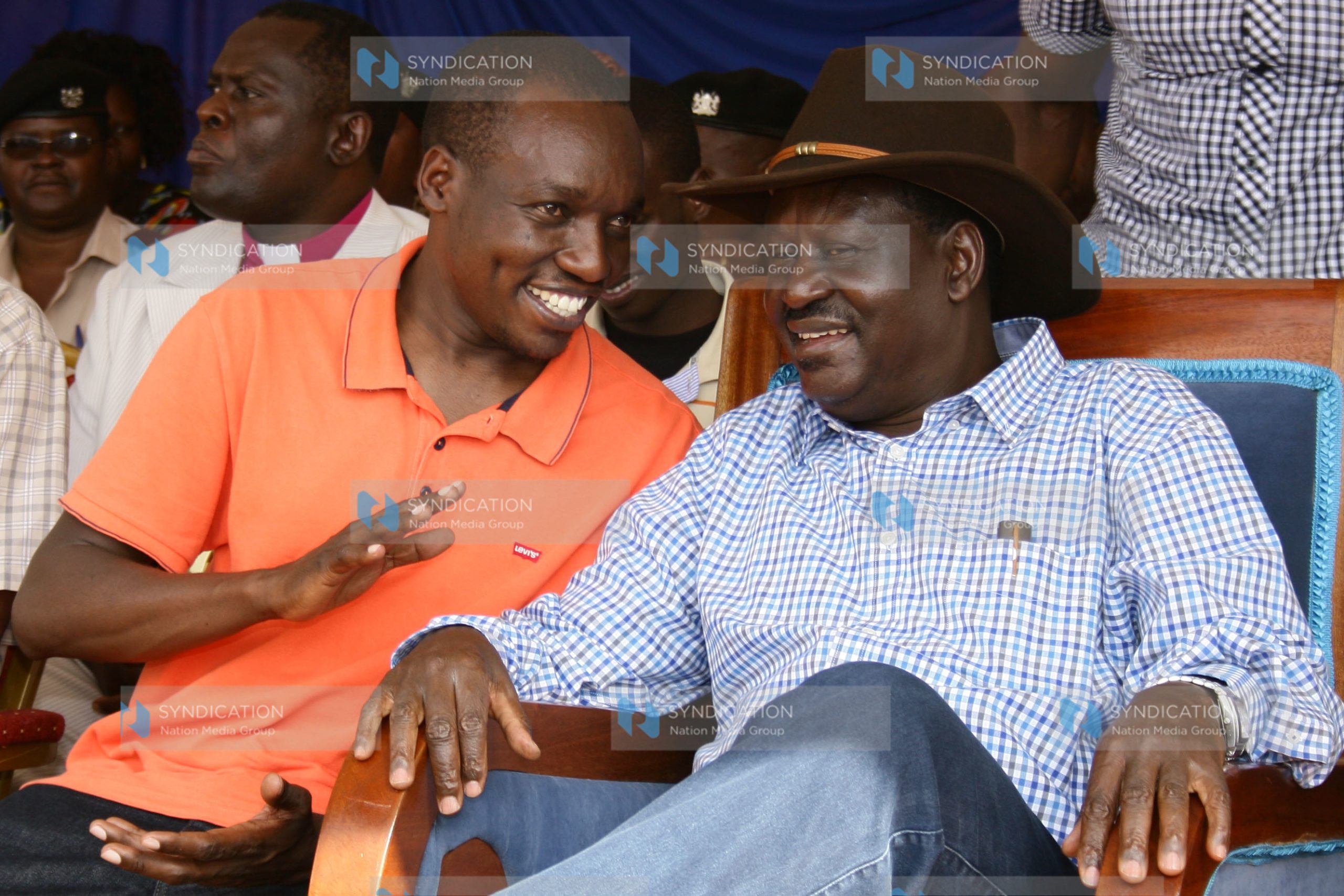 Former Prime Minister Raila Odinga conversing with Dagoreti North MP Simba Arati