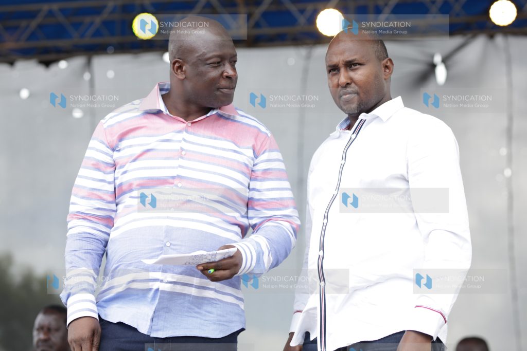 Nyatike MP Tom Odege chats with Suna East MP Junet Mohamed
