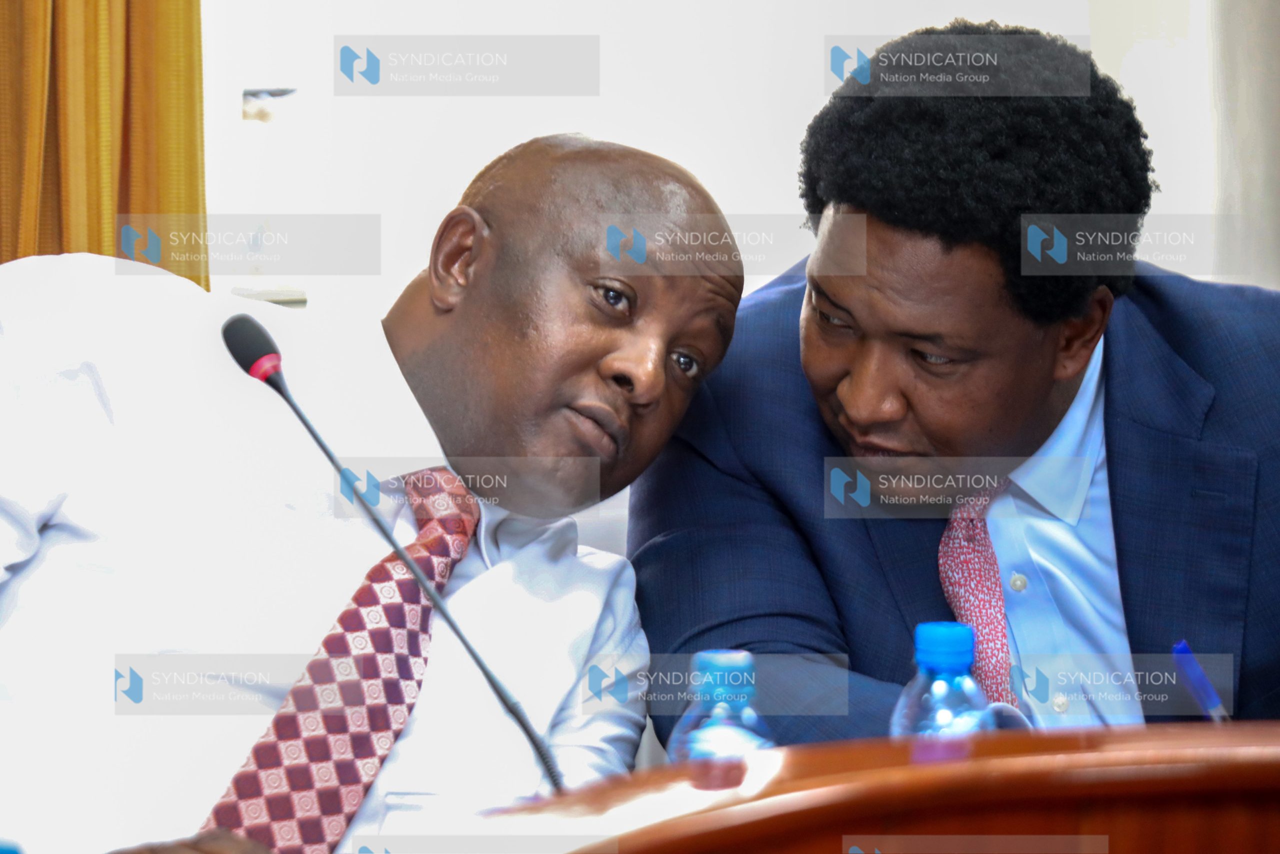 The Chairperson County Public Investment Committee (CPIC) Sen Godfrey Osotsi share a word with senator Olekina Ledama