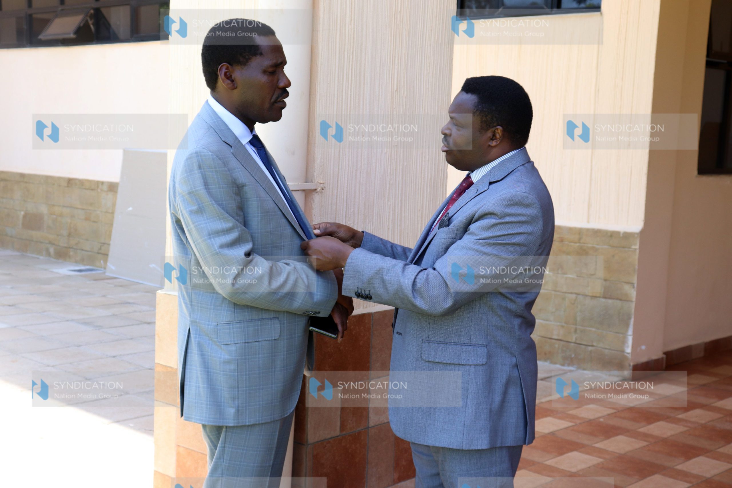 Peter Munya (left) and Tharaka Nithi Governor Muthomi Njuki