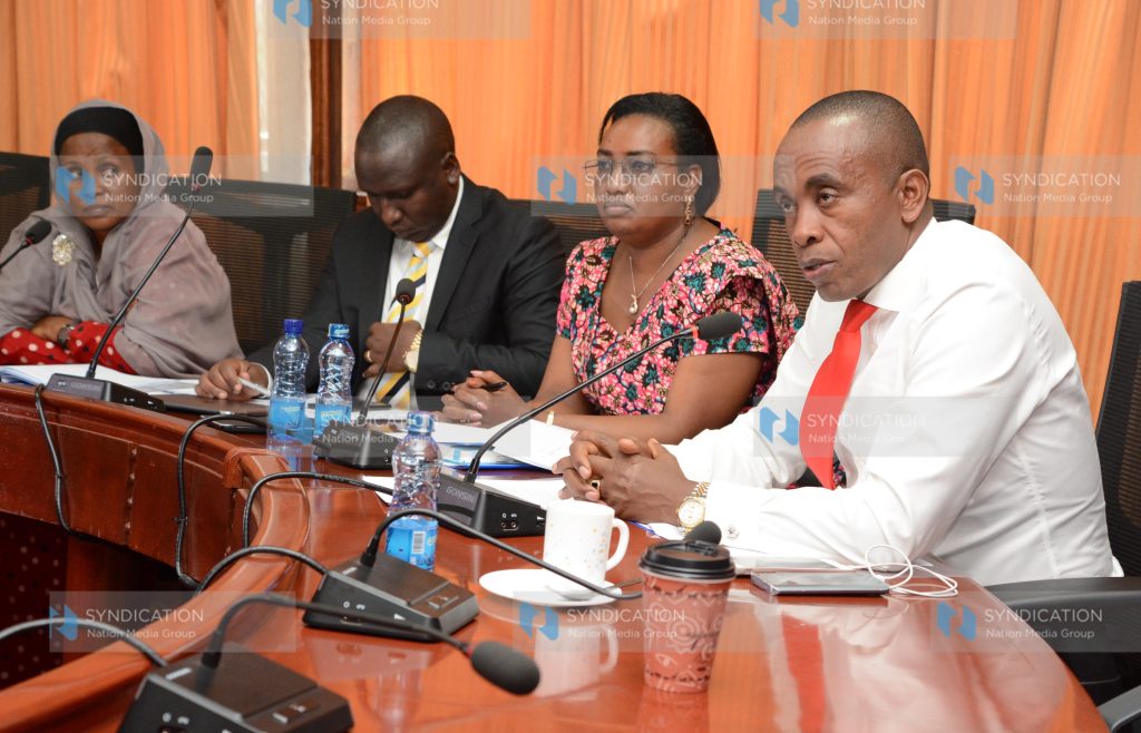 Kimani Wamatangi address the media at Parliament Buildings