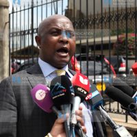 Godfrey Osotsi addressing the press at parliament buildings