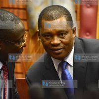 Justin Muturi (right) having a word with Vihiga Senator George Khaniri