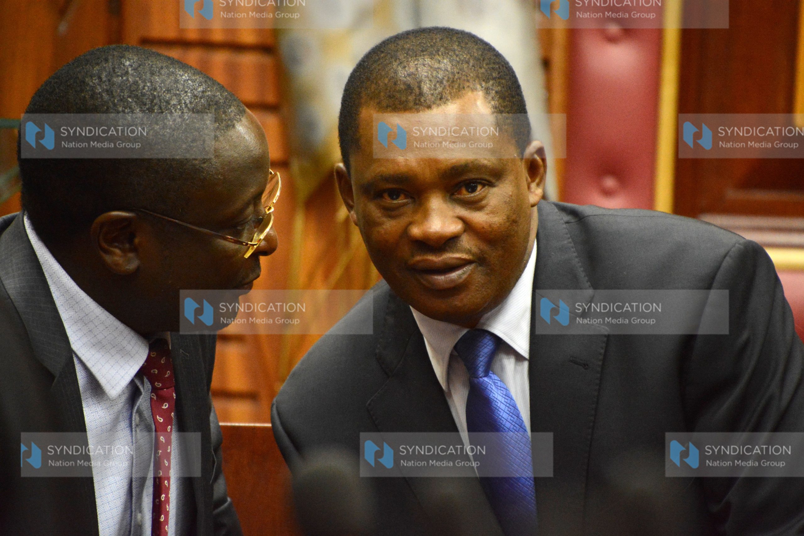 Justin Muturi (right) having a word with Vihiga Senator George Khaniri