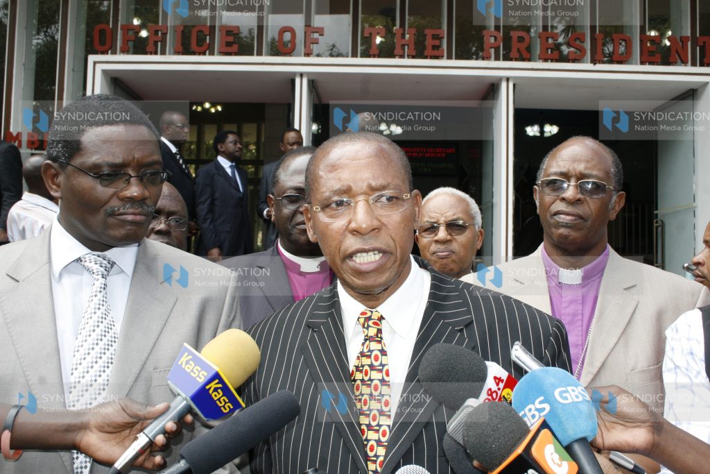 Justice Minister Mutula Kilonzo (centre) flanked with the NCCK Secretary General Peter Karanja (left) and ACK Bishop Gideon Githiga