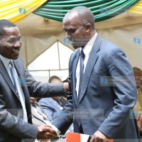 Council of Governors Chair Peter Munya shakes hands with NMG CEO Linus Gitahi