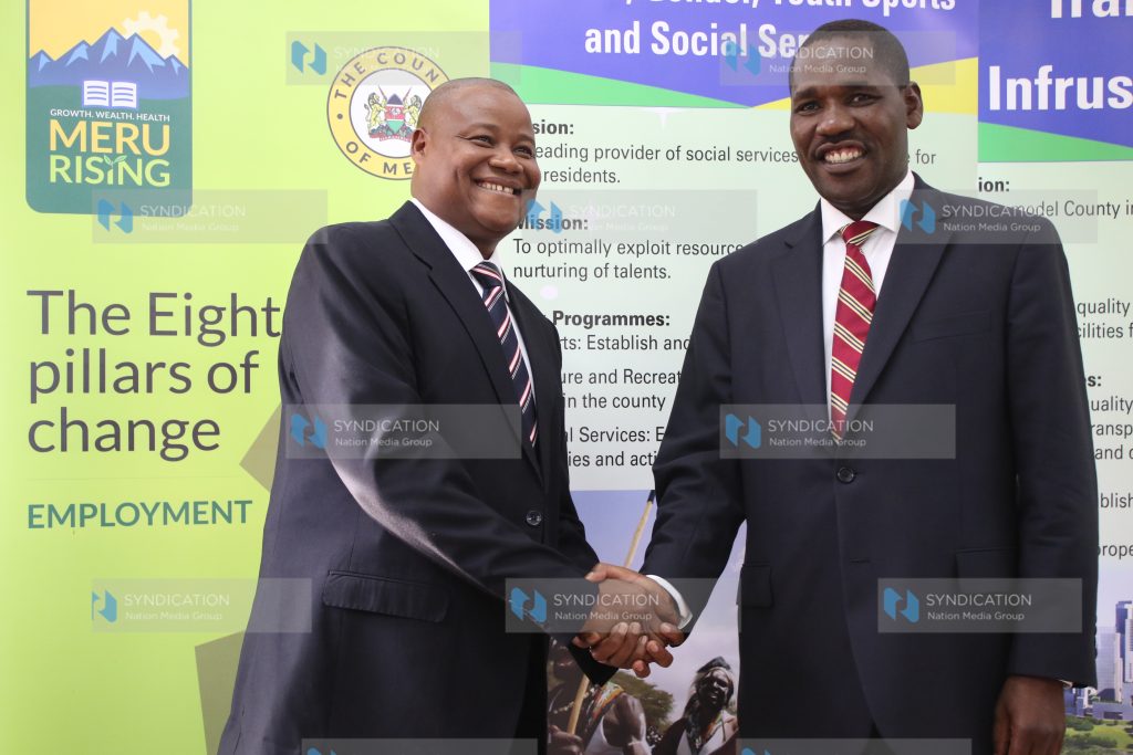 Genaro Guantai is congratulated by Meru County Governor Peter Munya