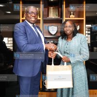 LSK President Faith Odhiambo receives a gift from NMG Managing Director and CEO Geoffrey Odundo