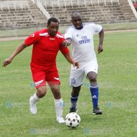 Joe Mutambu (left) vies for the ball against Senate team member Kipchumba Murkomen