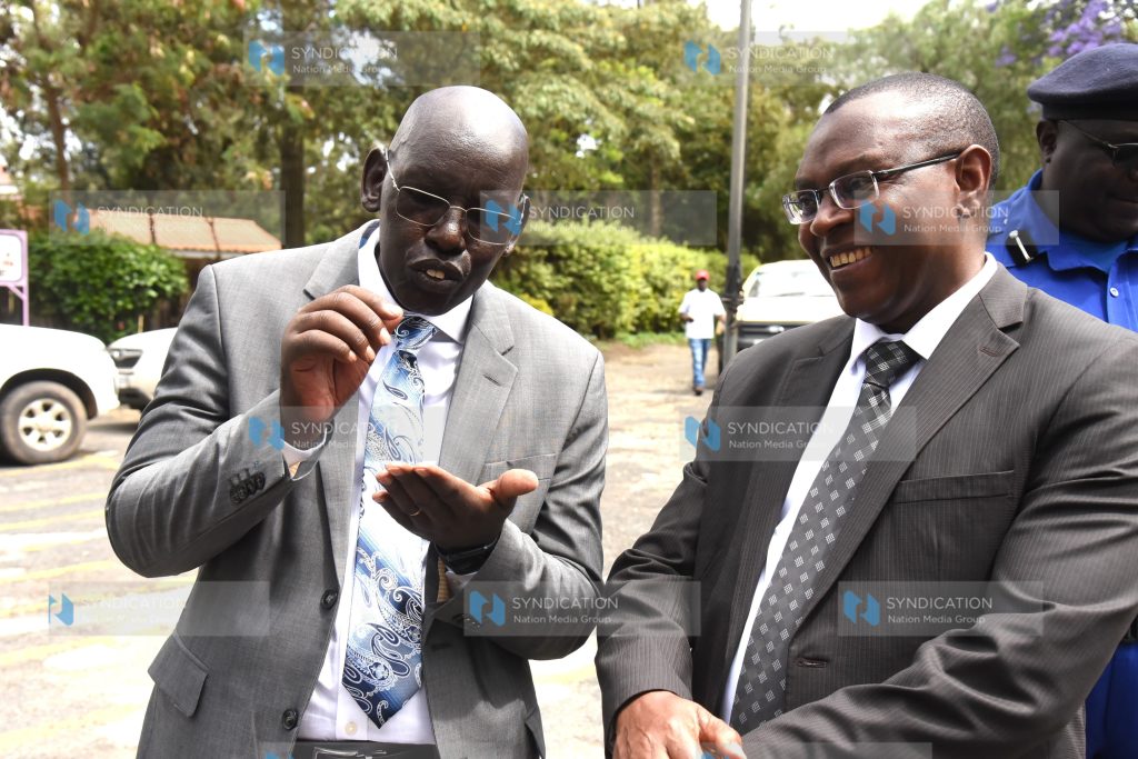 Dr Belio Kipsang chats with Dr David Njeng'ere CEO Kenya National Examinations Council