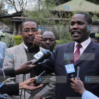 Meru County Governor Peter Munya, left, addresses journalists