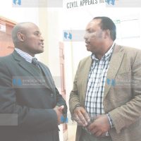 Lawyer Evans Ondiek (left) with Water Assistant Minister Ferdinand Waititu at the High Court
