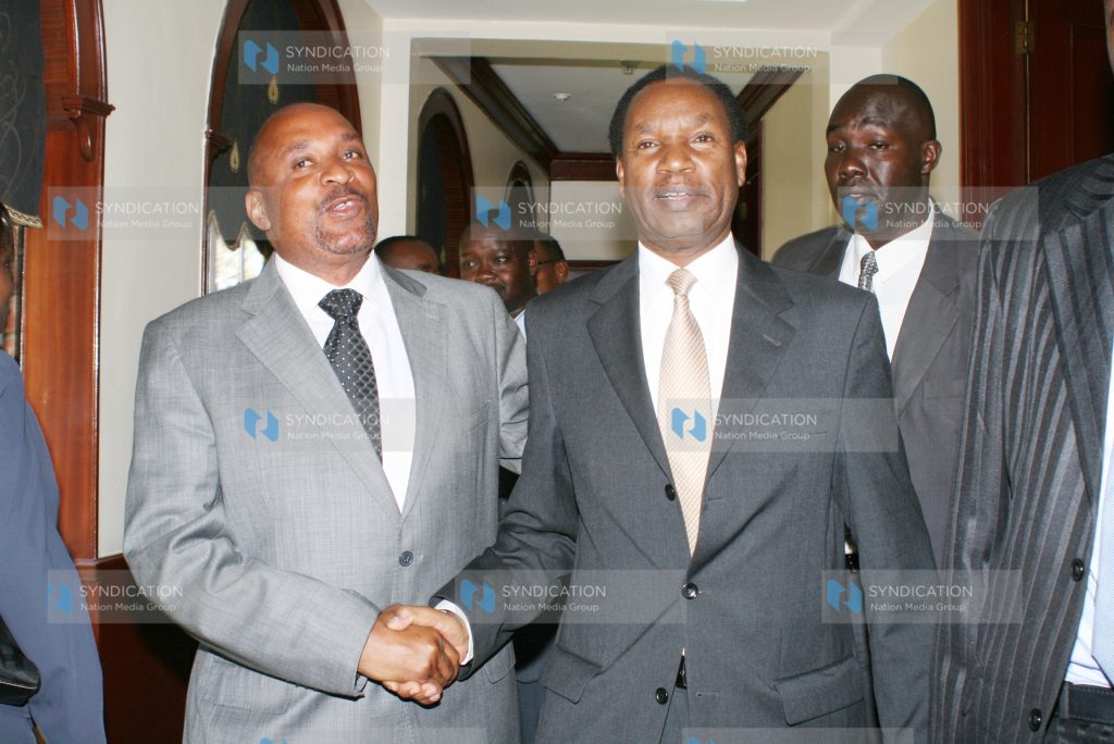 The Minister for Trade Henry Kosgey (right) with Member of Parliament Dan Mwazo after a press conference