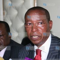 Minister for Education Mutula Kilonzo flanked by his permanent secretary George Godia