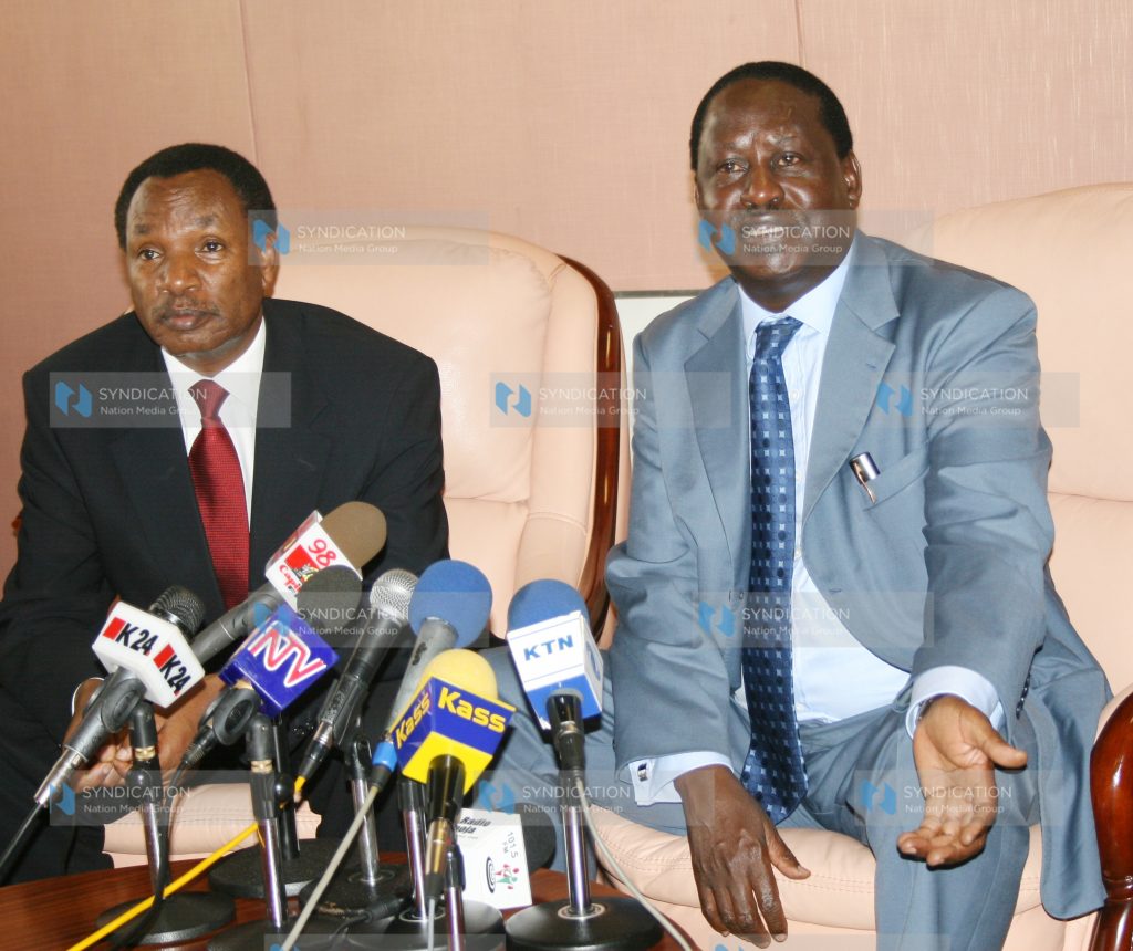 Prime Minister Raila Odinga (left) addresses journalists at a press conference