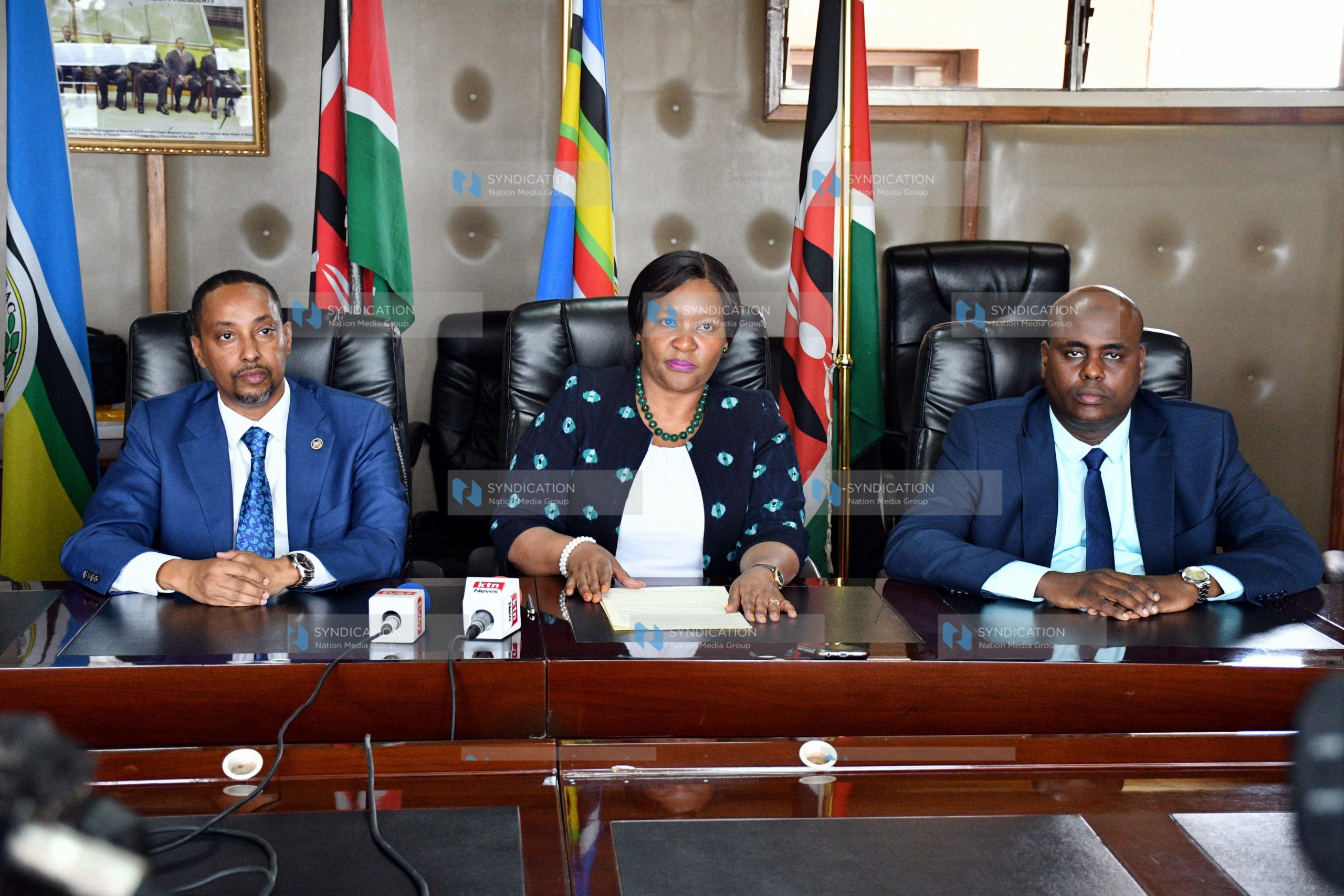 Rebecca Miano (center) makes her remarks during a press conference